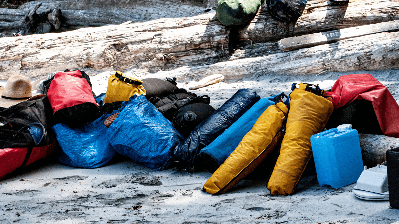 colorful dry bags on the beach