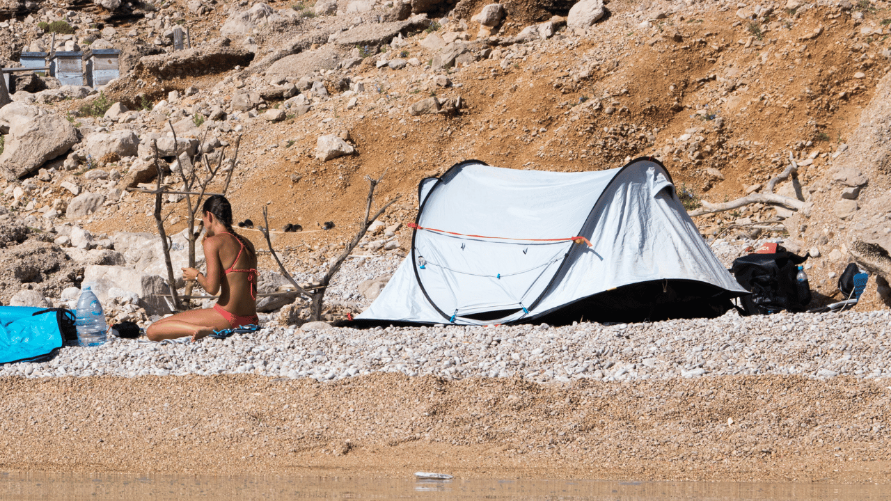 woman camping on beach