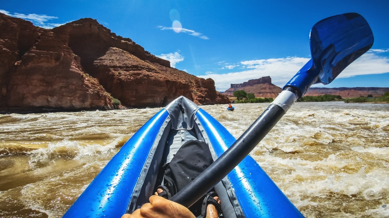 Kayaking an inflatable whitewater kayak on Colorado river