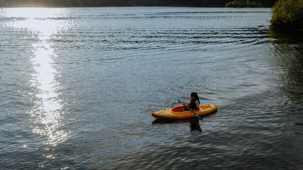 Woman kayaking on a lake